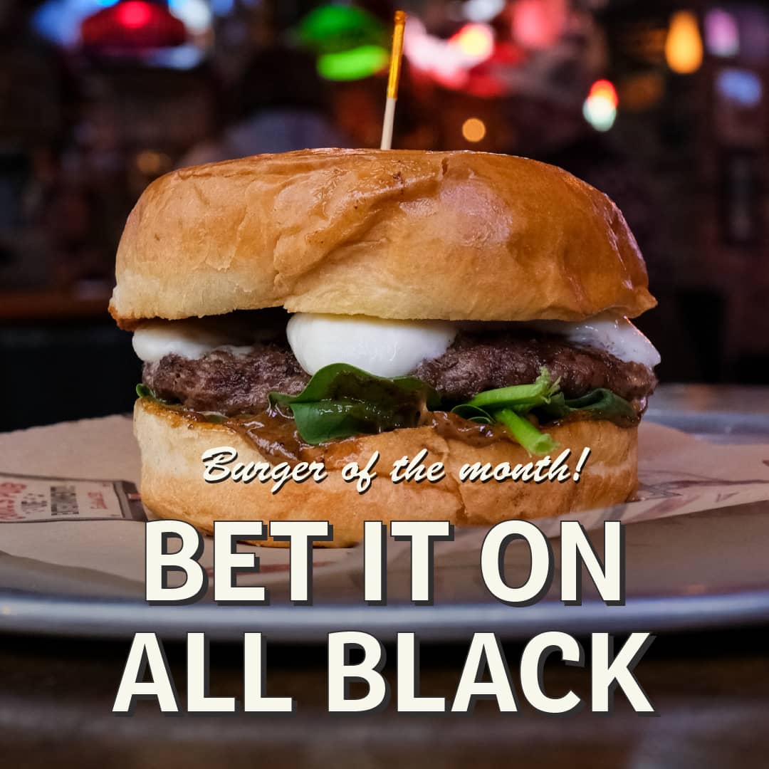 Promotional image for September's Sandwich of the Month at Carol's Pub: Bet In On Black Burger